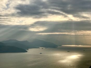 Scenic view of sea against cloudy sky