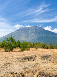 Scenic view of mount agung potrait against sky