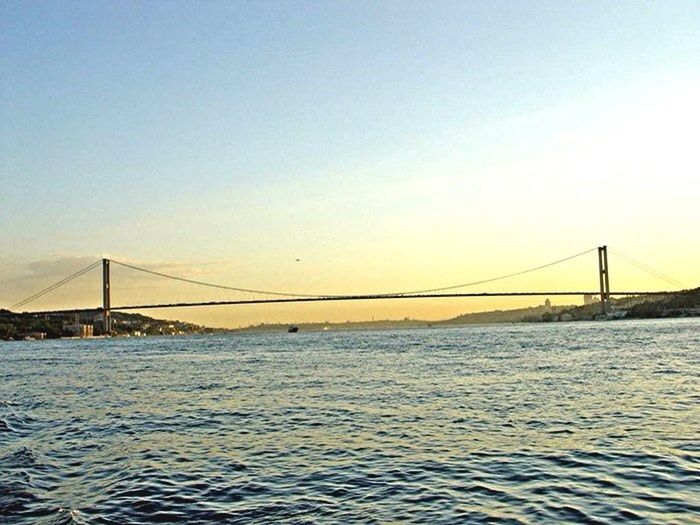 connection, water, bridge - man made structure, suspension bridge, engineering, sea, waterfront, built structure, bridge, clear sky, copy space, tranquil scene, transportation, tranquility, rippled, architecture, scenics, river, sunset, nature