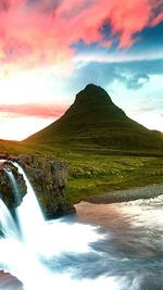 Scenic view of mountains against sky at sunset