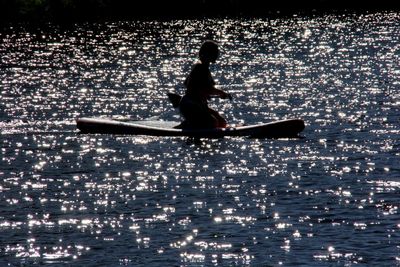 Silhouette man in sea