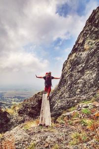 Full length of woman standing on rock