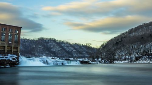 Scenic view of snow covered landscape at sunset