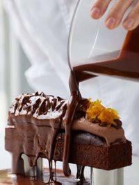 Midsection of woman holding cake
