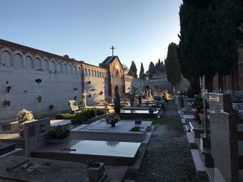 Fountain in city against clear sky