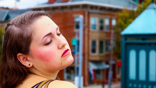 Close-up portrait of a girl looking away