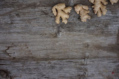 Close-up of ginger on wooden table