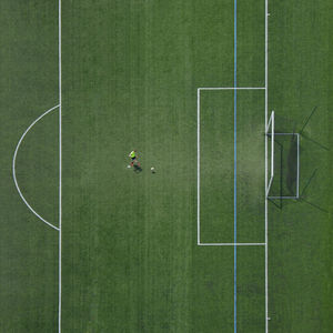 High angle view of soccer ball on green grass