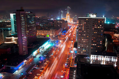 High angle view of illuminated city buildings at night