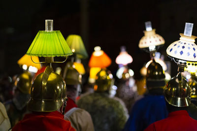 Basel, switzerland - february 27th 23. close-up of piccolo players in costumes with head lanterns.