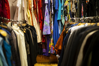 Clothes hanging in rack at market