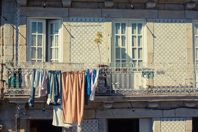 Clothes drying on balcony of building