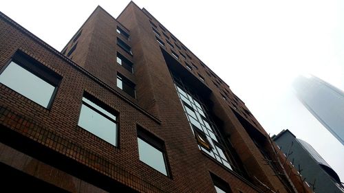 Low angle view of modern building against clear sky