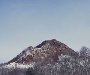 Low angle view of mountain against clear sky