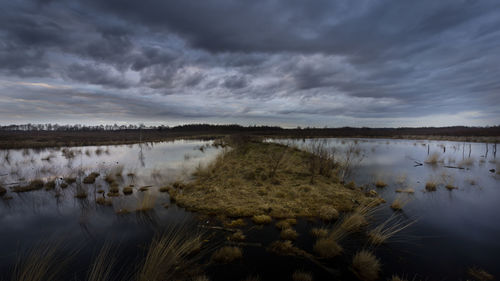 Panoramic view of lake against cloudy sky