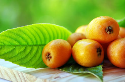 Loquats on wooden table