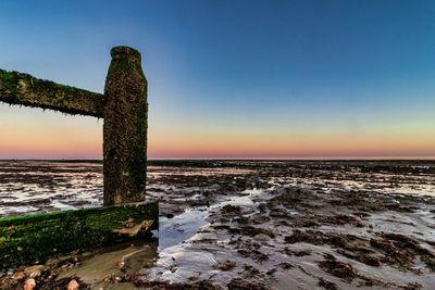 Scenic view of sea against clear sky during sunset