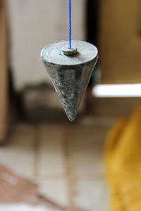 Close-up of cone shape hanging in industry