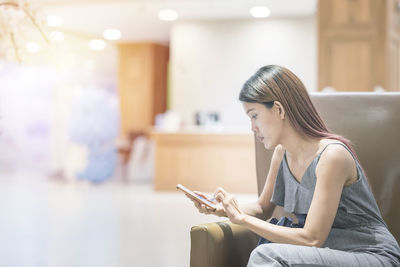 Young woman using mobile phone