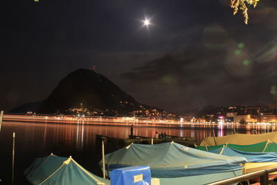 Boats moored at harbor