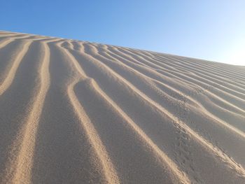 Scenic view of desert against clear sky