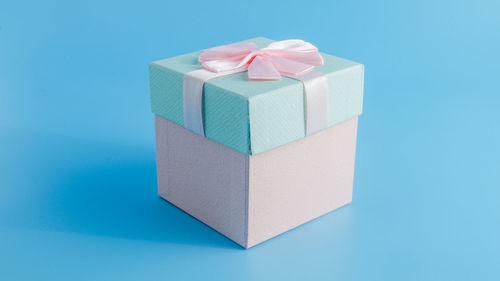 Close-up of gift box against blue background