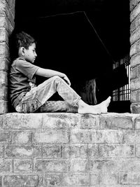 Boy sitting outdoors