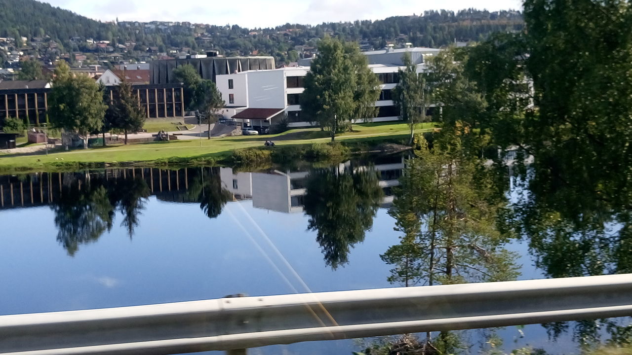 architecture, built structure, building exterior, water, residential structure, residential building, reflection, house, tree, canal, city, residential district, day, waterfront, no people, standing water, tranquility, development