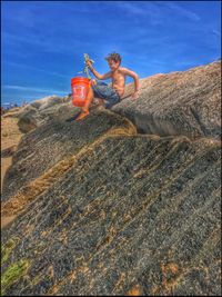 Young man standing on beach