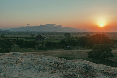 Scenic view of landscape against sky during sunset