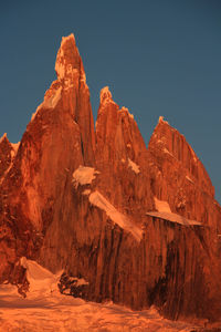 Scenic view of rocky mountains against clear sky