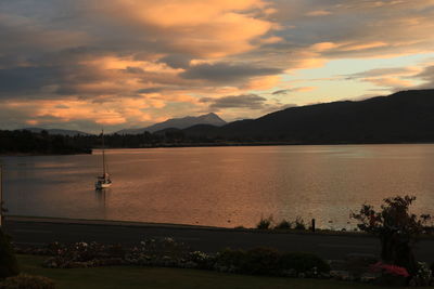 Scenic view of lake at sunset