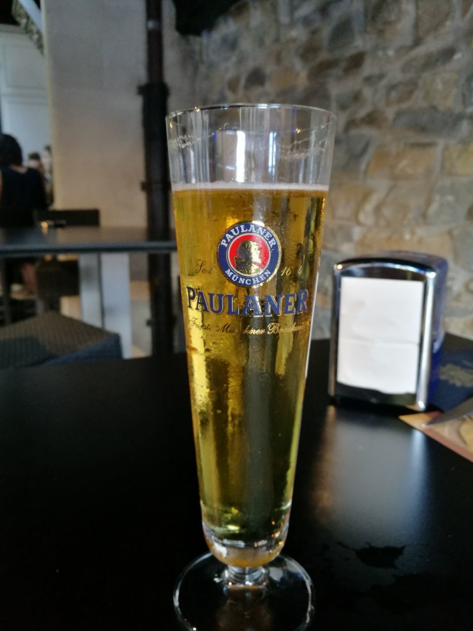 CLOSE-UP OF DRINK IN GLASS ON TABLE