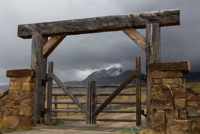 Built structure on landscape against sky