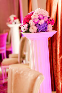 Bunch of flowers on column at wedding reception