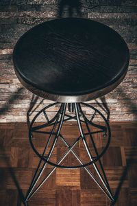 High angle view of metal hanging on table