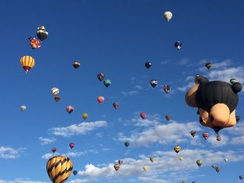 Low angle view of hot air balloons against sky