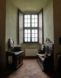 Medieval fortress interior cabinet with window and wooden brown furniture