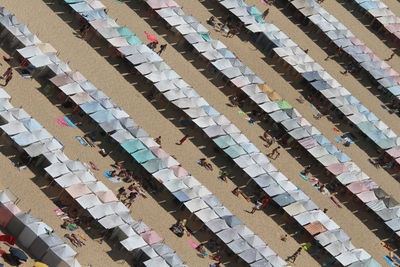 Aerial view of tourists resting under parasols