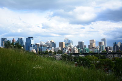 Buildings in city against sky