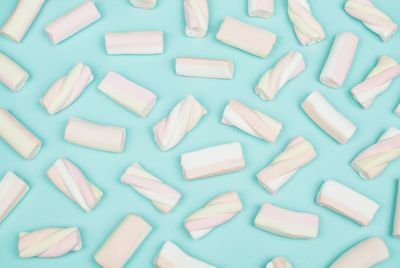 Full frame shot of candies on blue background