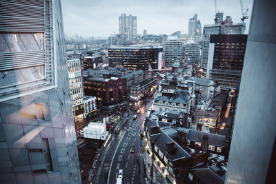 High angle view of modern buildings in city against sky