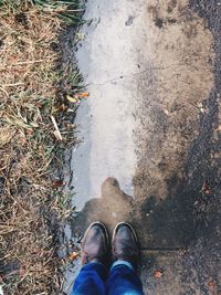 Low section of woman in puddle