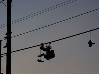 Low angle view of telephone pole against sky