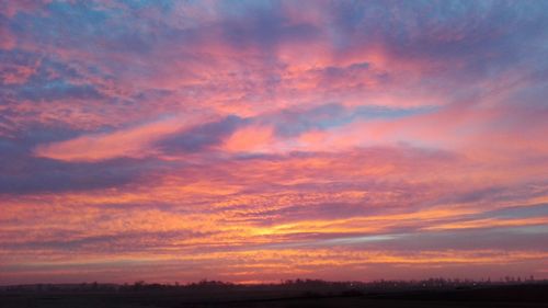 Scenic view of dramatic sky during sunset