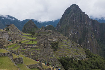 Scenic view of mountains against cloudy sky