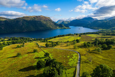Scenic view of landscape and mountains against sky