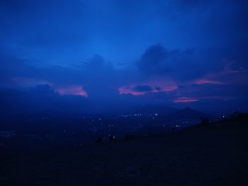 Scenic view of silhouette landscape against sky at night