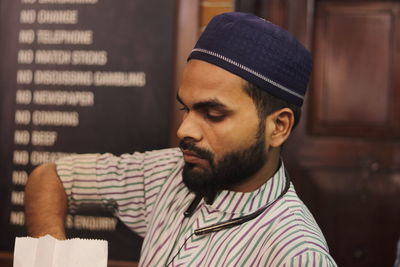 A muslim waiter at an irani cafe in mumbai