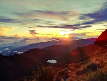 Scenic view of mountains against sky during sunset